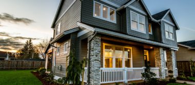 Photo of a two story grey house.